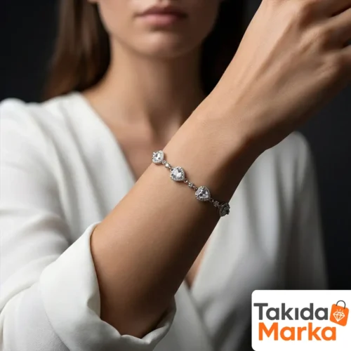 1-162-1.webp Beyaz Taşlı Damla ve Yuvarlak Motifli Gümüş Kadın Bileklik